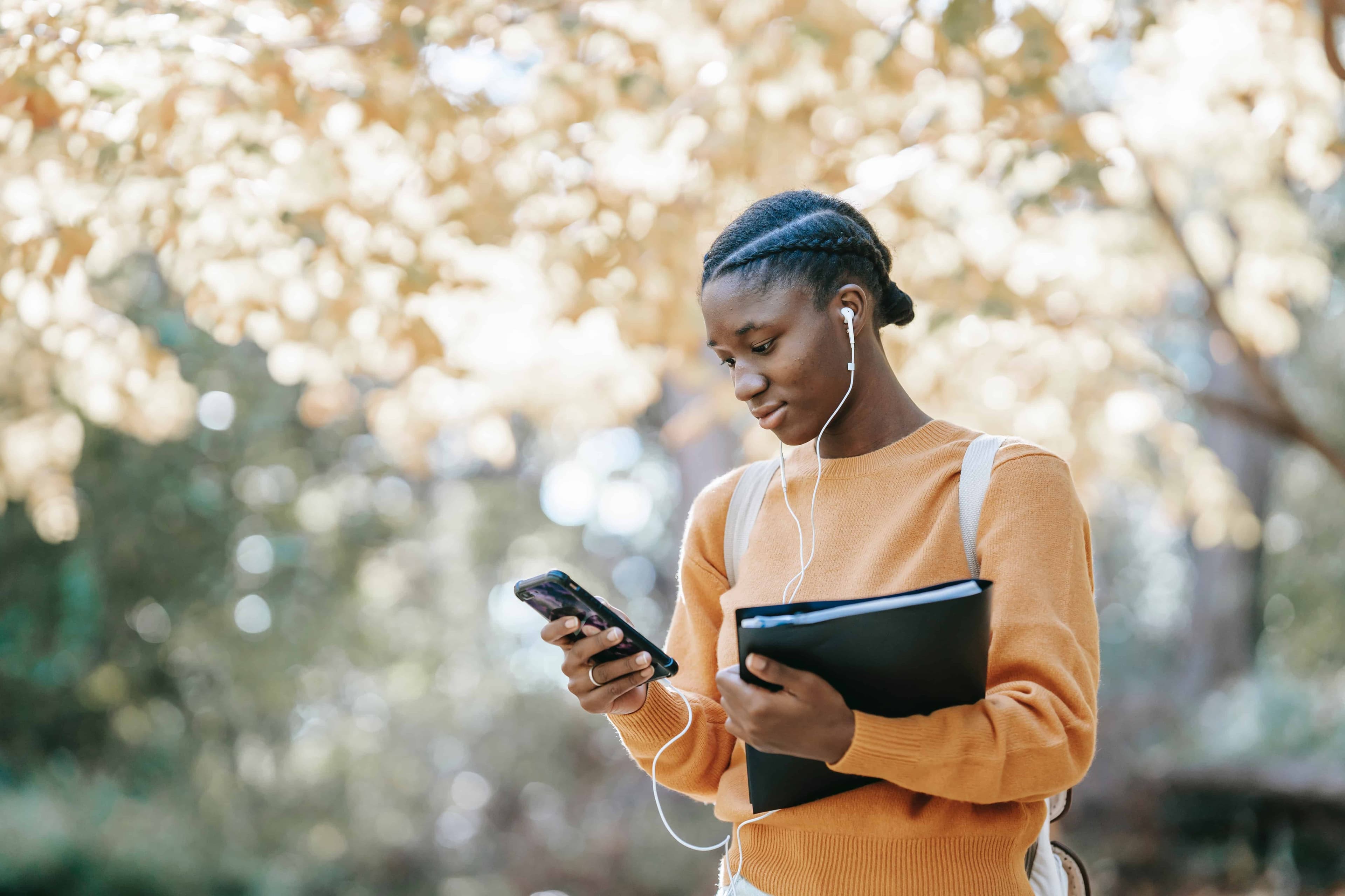 student pressing phone